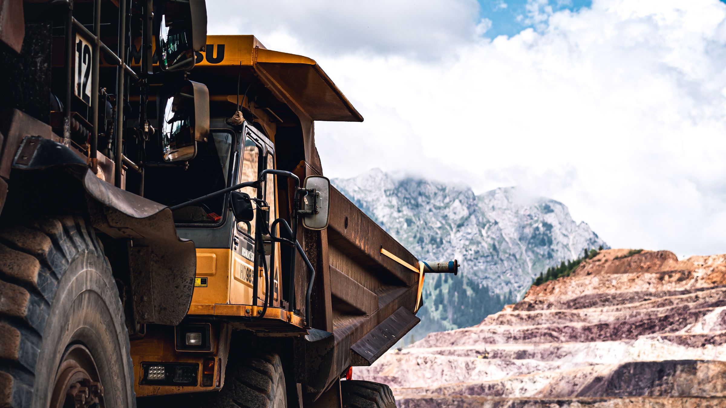 Mining haul truck working on a mountain bench